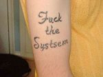 fuck-the-systsem-misspelled-tattoo